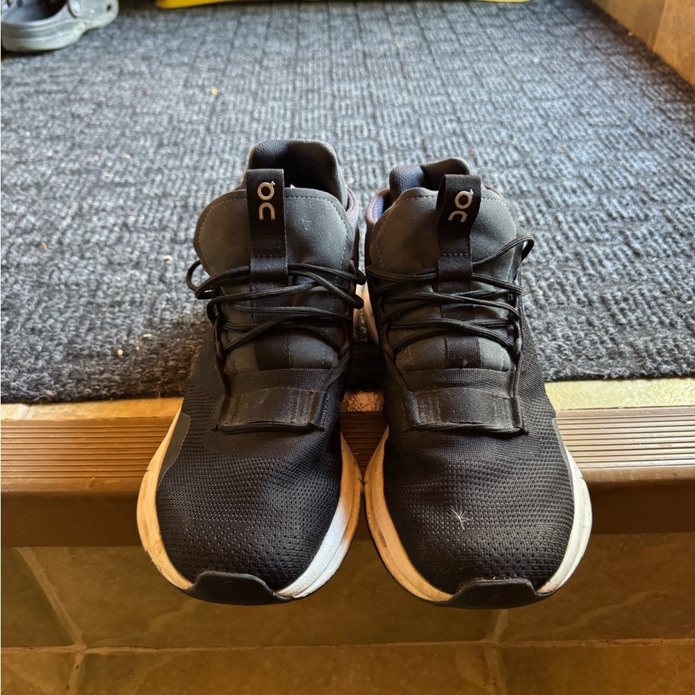 On Running Black Athletic Shoes with White Soles